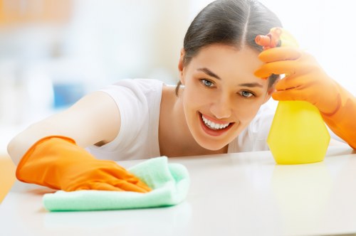 Local carpet care service treating stained flooring in a busy interior