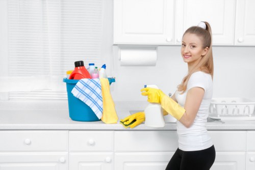 Cleaner inspecting carpet cleaning equipment before use