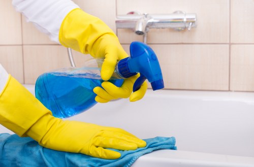 Staff member handling carpet cleaning chemicals safely